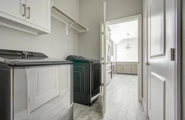 a utility room with closet dryer and washer