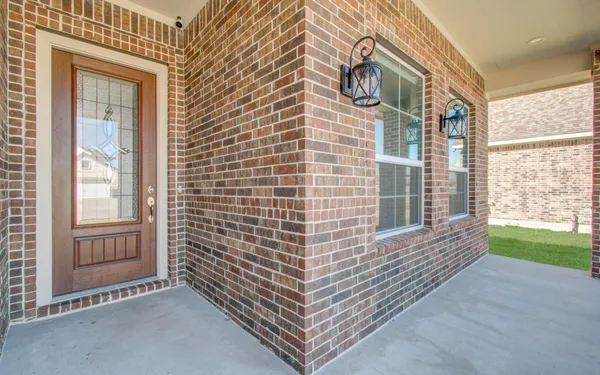 a view of outdoor space deck and brick wall