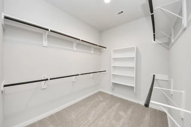 a view of empty room with a fireplace