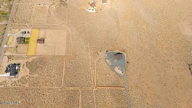 an aerial view of residential house with beach