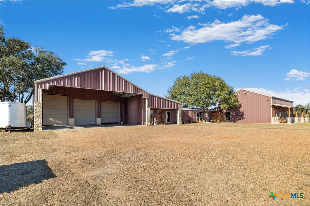 2796 Benbow Road Inez, TX 77968 - Photo 28 of 35 a front view of a house with a yard and garage