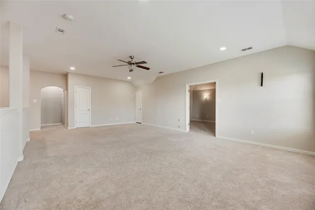 a view of an empty room with a bathroom