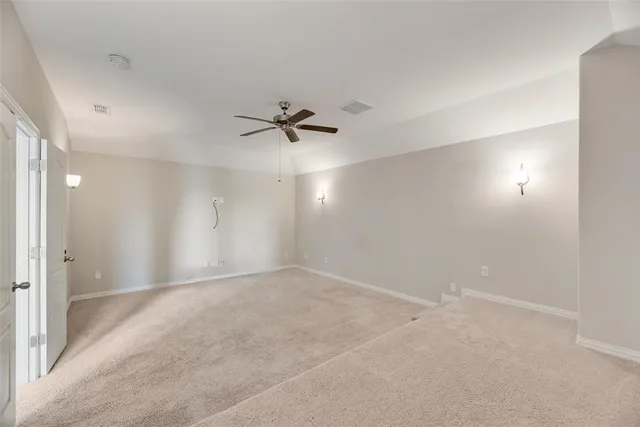 a view of an empty room with a bathroom