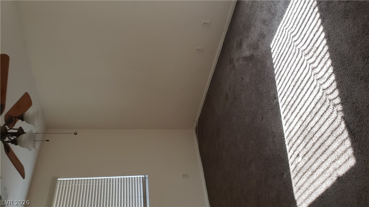 9112 Manalang Road Las Vegas, NV 89123 - Photo 22 of 50 A well-proportioned bedroom with ceiling fan and soft carpeting, ready for personal touches.