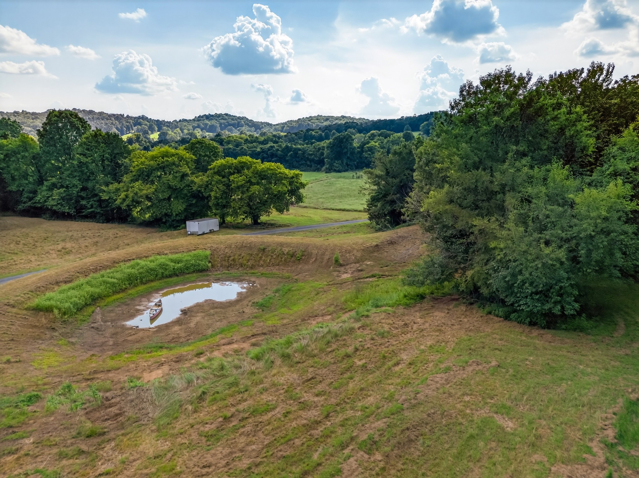 53 Daves Hollow Road Fayetteville, TN 37334 - Photo 14 of 40 a view of a grassy area with mountains and a houses