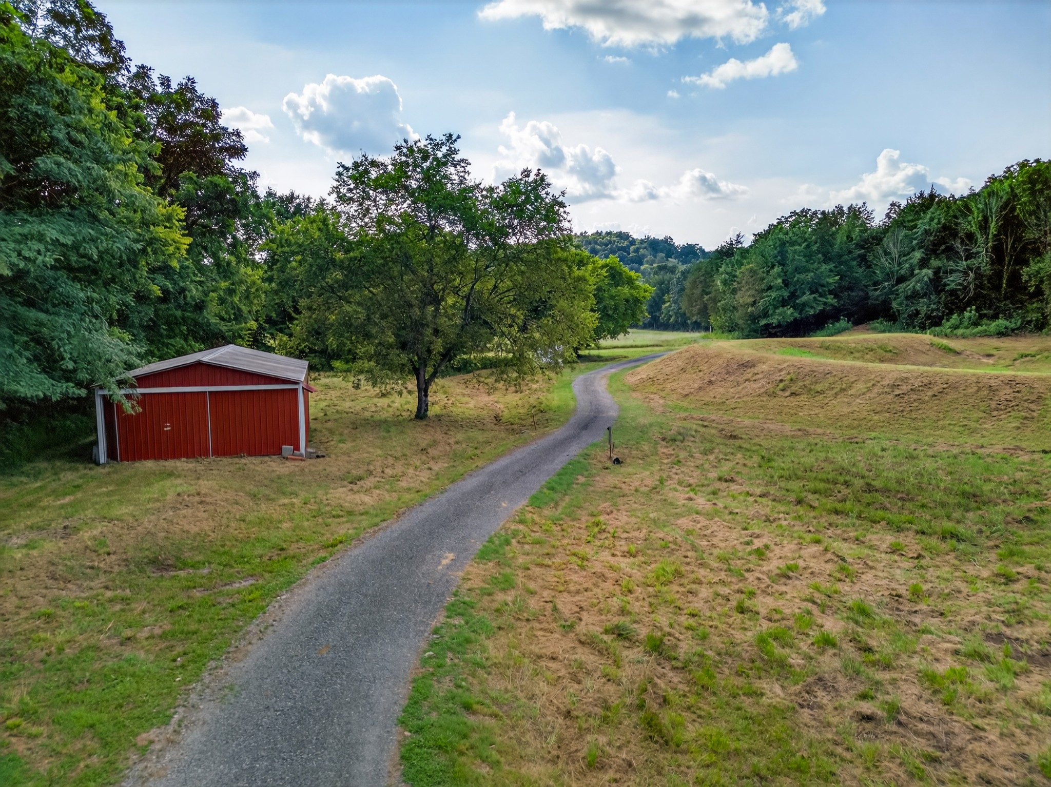 53 Daves Hollow Road Fayetteville, TN 37334 - Photo 16 of 40 a backyard of a house with lots of green space
