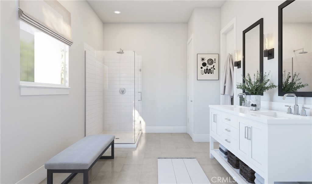19424 Cereus Road Apple Valley, CA 92307 - Photo 12 of 12 a bathroom with a double vanity sink a mirror and a bathtub