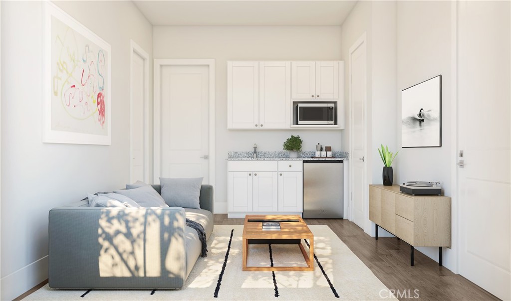 19424 Cereus Road Apple Valley, CA 92307 - Photo 6 of 12 a room with furniture a flat screen tv and a window