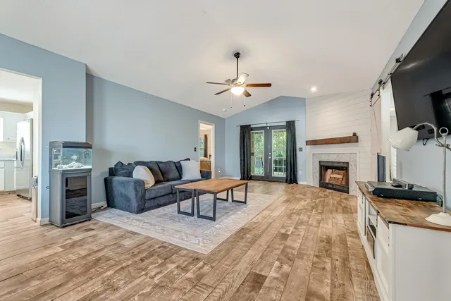 a living room with furniture and a flat screen tv