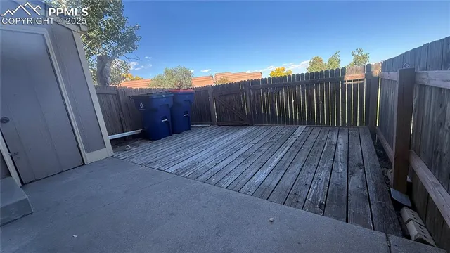 a view of balcony with wooden floor