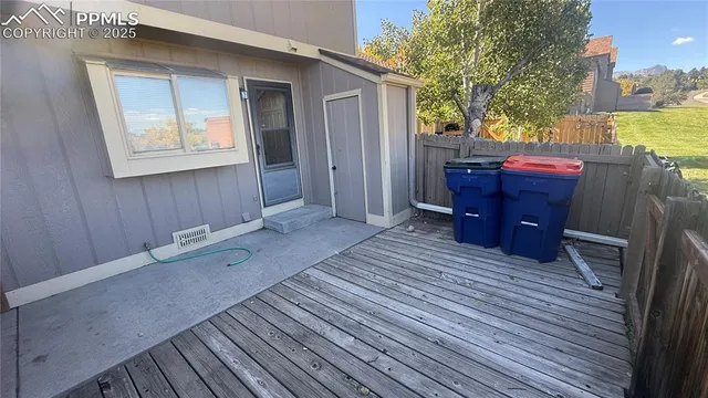a room with wooden floor and furniture