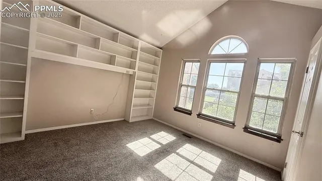 an empty room with windows