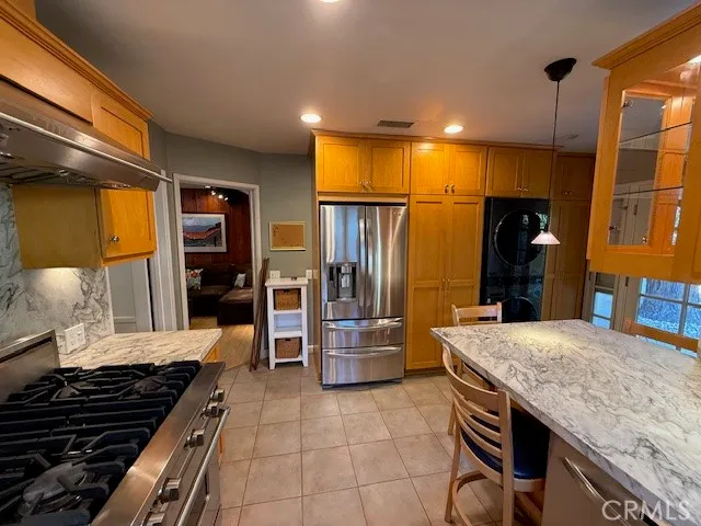a kitchen with a sink and refrigerator
