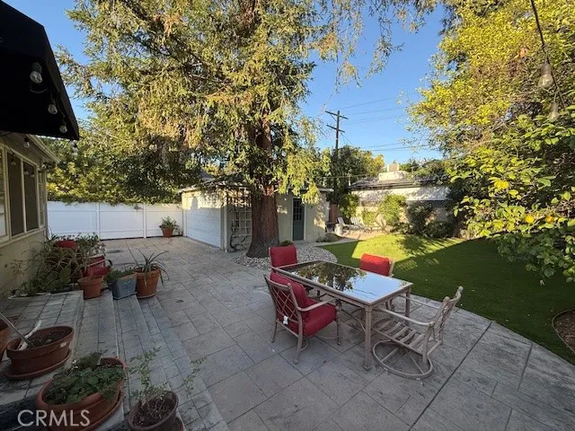 a backyard of a house with outdoor seating