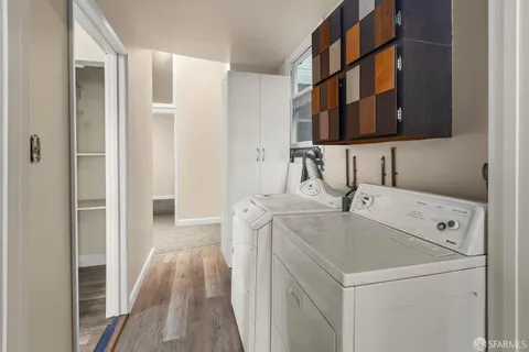 an empty room with a bathroom and a shower