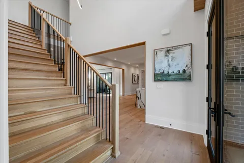 a kitchen with a table chairs sink and cabinets