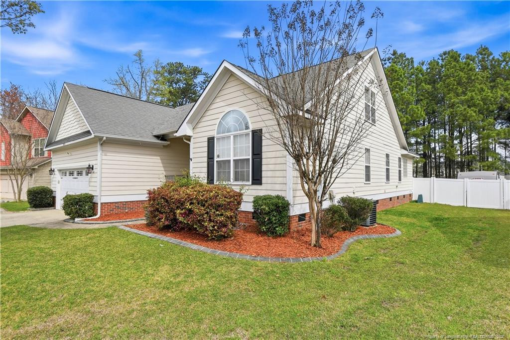 212 Lennox Loop Raeford, NC 28376 - Photo 41 of 47 front view of a house with a yard