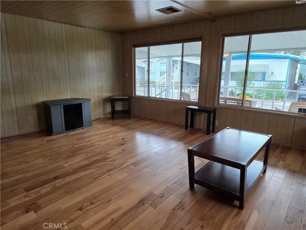 a view of kitchen cabinetry and wooden floor