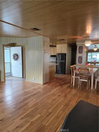 a kitchen with refrigerator and microwave