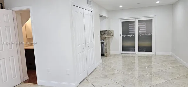 a view of an empty room with a window