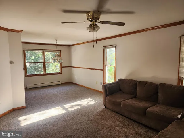 a living room with furniture and a window