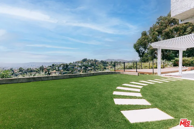 a view of a park with large trees