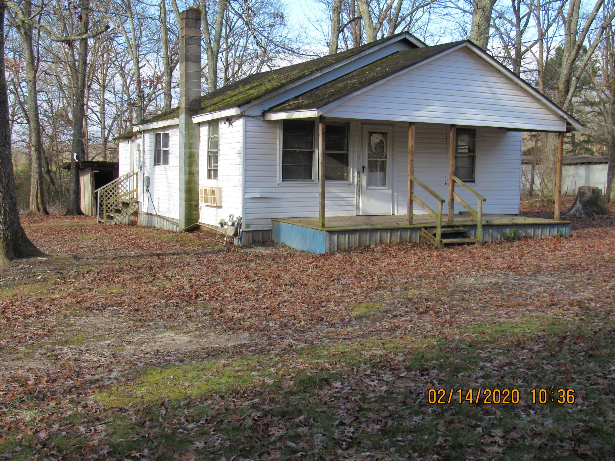 1451 Rome Road Lancing, TN 37770 - Photo 3 of 22 a front view of a house with garden