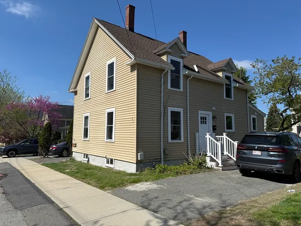 a front view of a house with a yard
