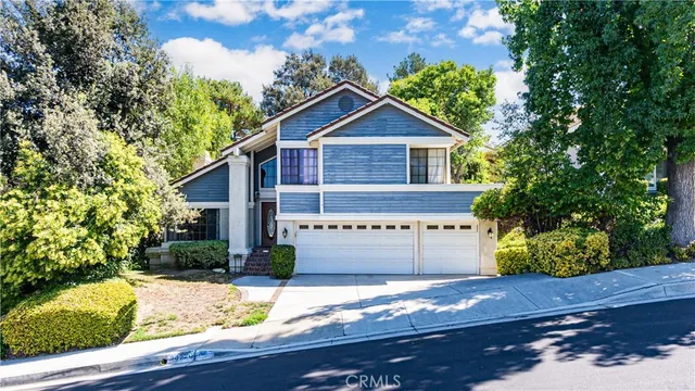 a view of house with yard