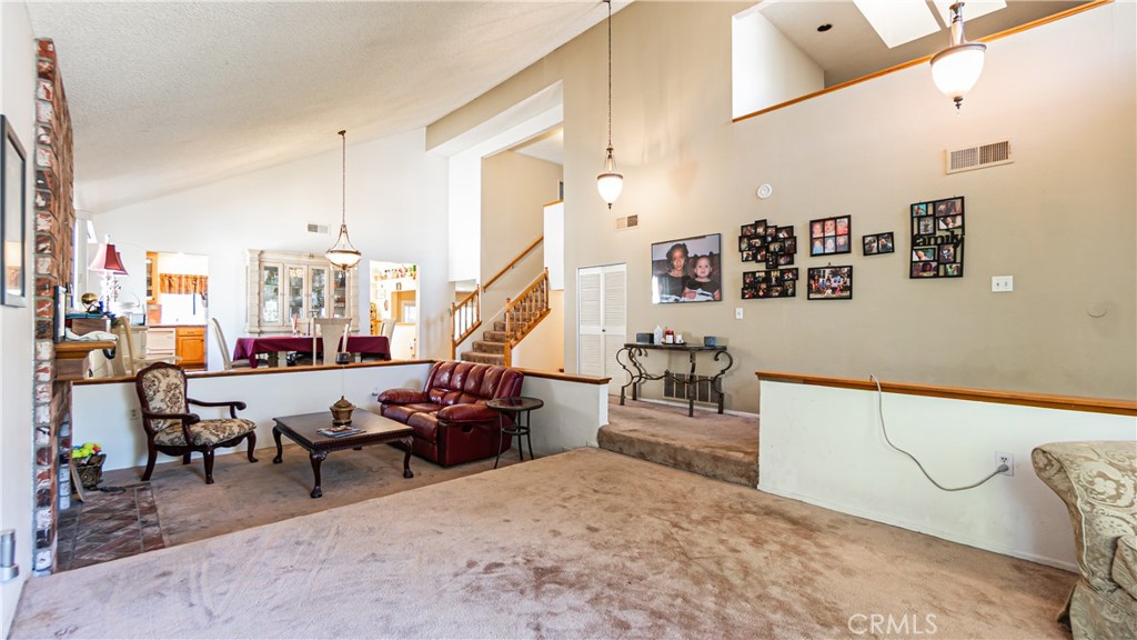 24220 Mentry Drive Newhall, CA 91321 - Photo 11 of 50 a living room with lots of furniture and appliances