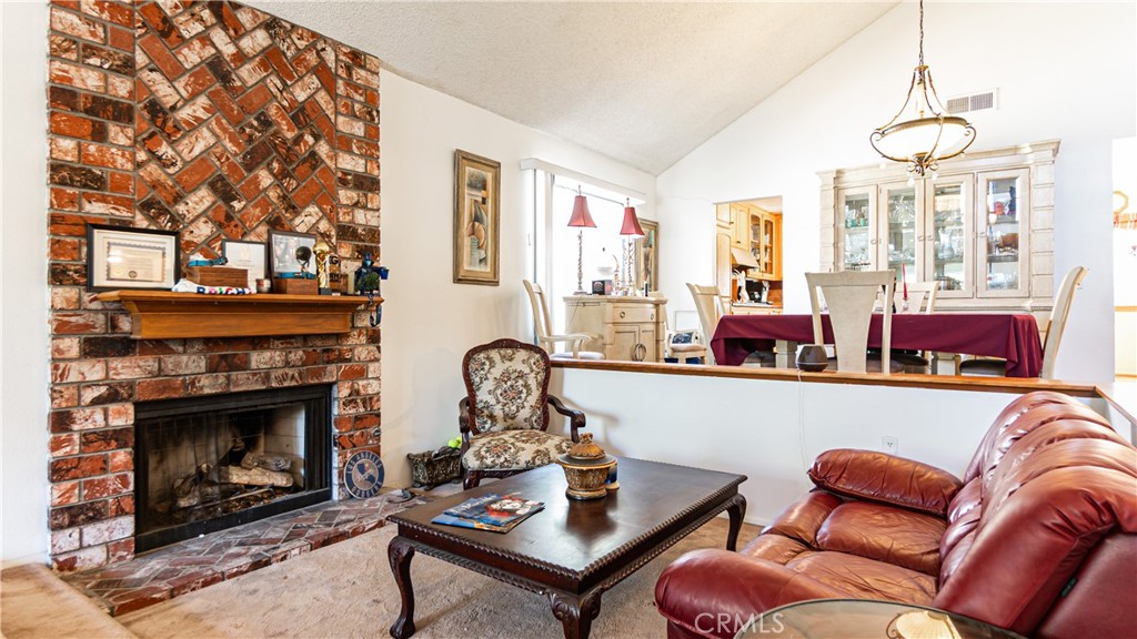 24220 Mentry Drive Newhall, CA 91321 - Photo 13 of 50 a living room with furniture fireplace and window