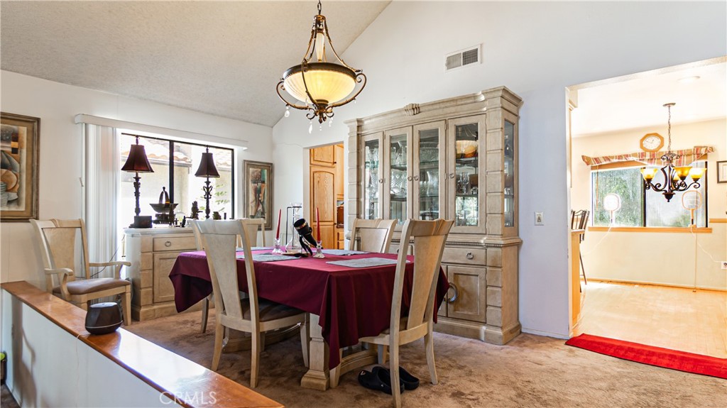 24220 Mentry Drive Newhall, CA 91321 - Photo 14 of 50 a view of a dining room with furniture window and outside view