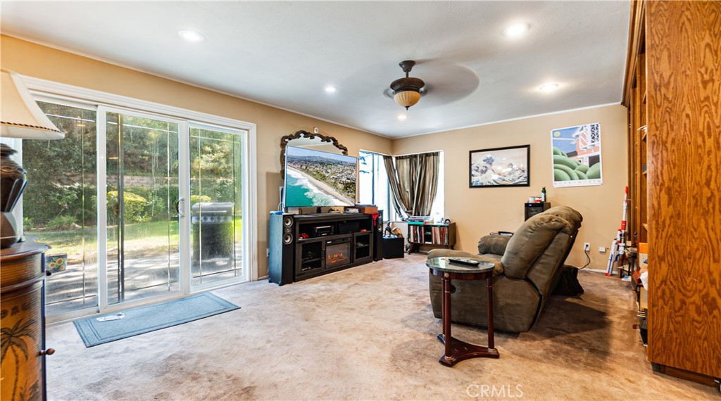 24220 Mentry Drive Newhall, CA 91321 - Photo 16 of 50 a living room with furniture and a flat screen tv