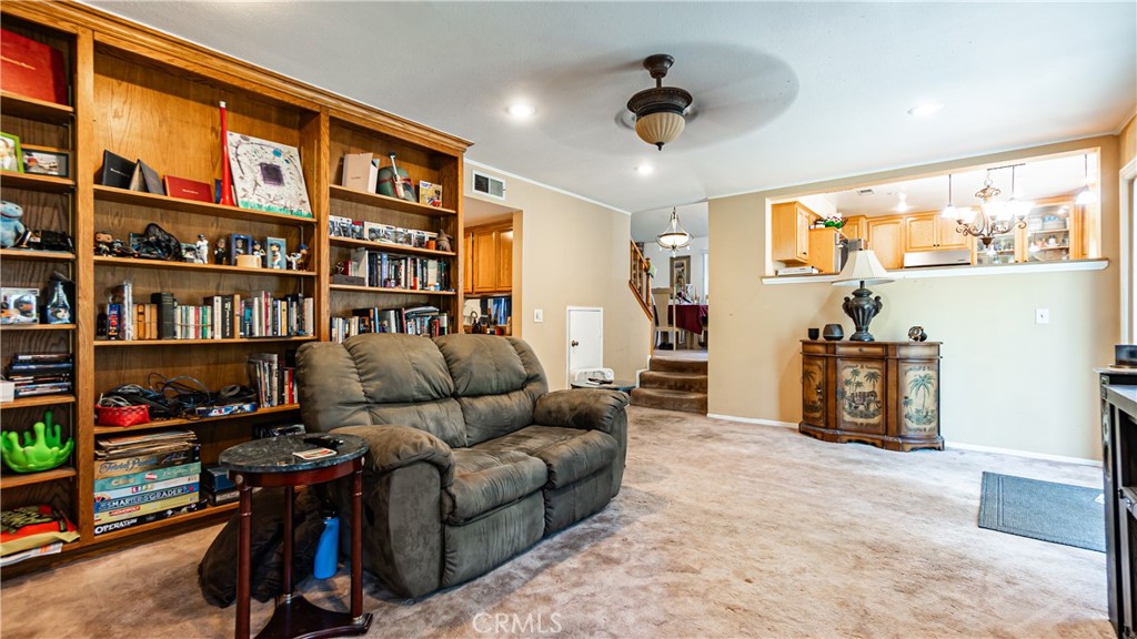 24220 Mentry Drive Newhall, CA 91321 - Photo 17 of 50 a living room with furniture gym equipment and a flat screen tv
