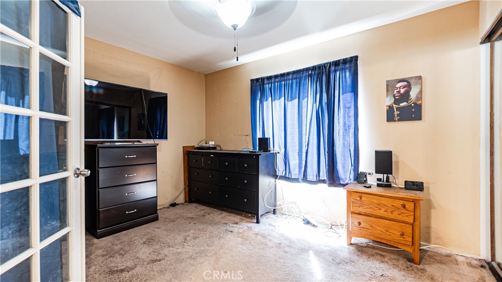 24220 Mentry Drive Newhall, CA 91321 - Photo 19 of 50 a room with a bed and a television