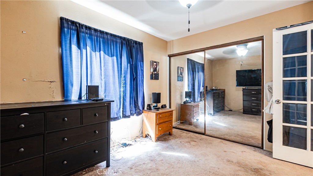 24220 Mentry Drive Newhall, CA 91321 - Photo 20 of 50 a view of a hallway with wooden floor and cabinet