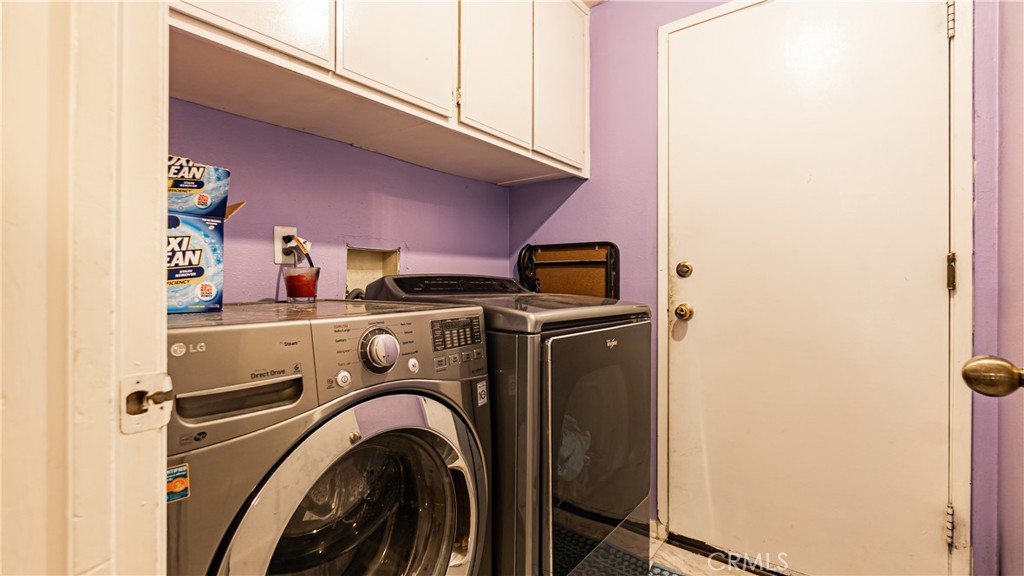 24220 Mentry Drive Newhall, CA 91321 - Photo 22 of 50 a utility room with dryer and washer