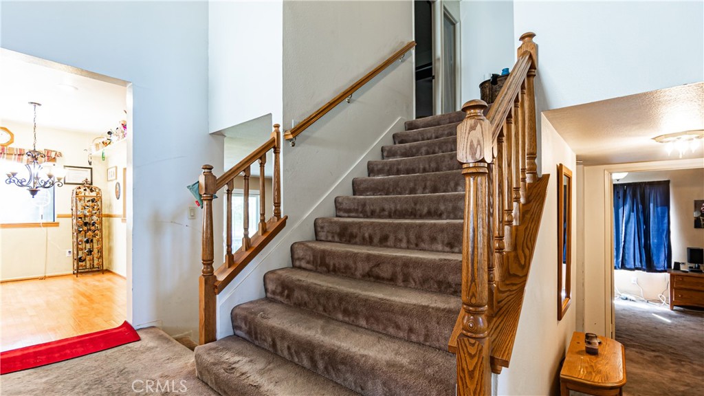 24220 Mentry Drive Newhall, CA 91321 - Photo 23 of 50 a view of staircase with lots of frames on wall and a window
