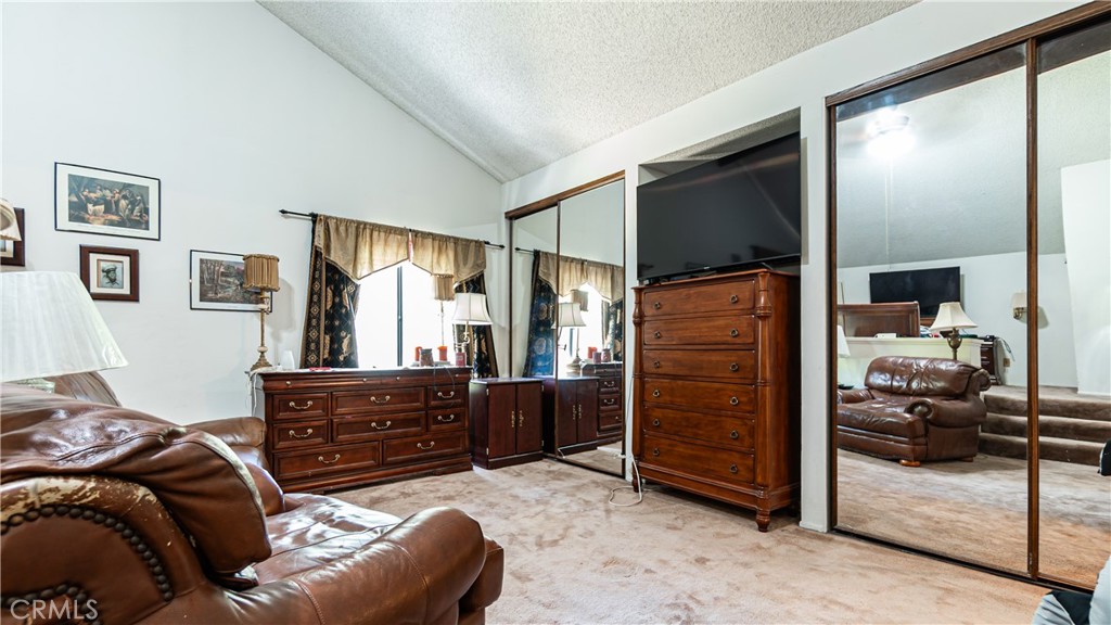 24220 Mentry Drive Newhall, CA 91321 - Photo 24 of 50 a bedroom with a bed and a dresser