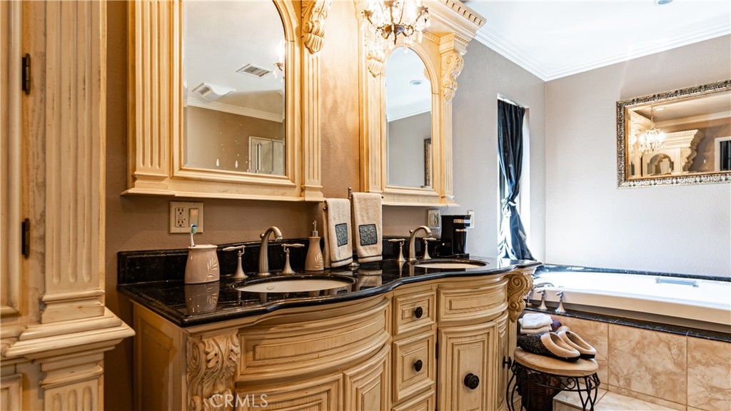 24220 Mentry Drive Newhall, CA 91321 - Photo 27 of 50 a kitchen with stainless steel appliances granite countertop a sink and a cabinets