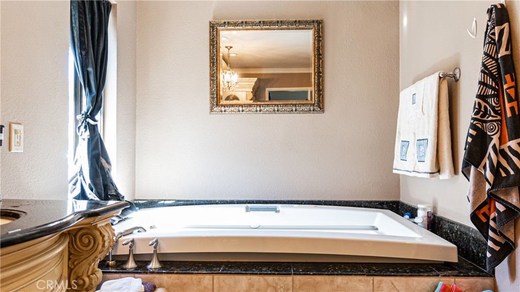 24220 Mentry Drive Newhall, CA 91321 - Photo 28 of 50 a bathroom with a tub