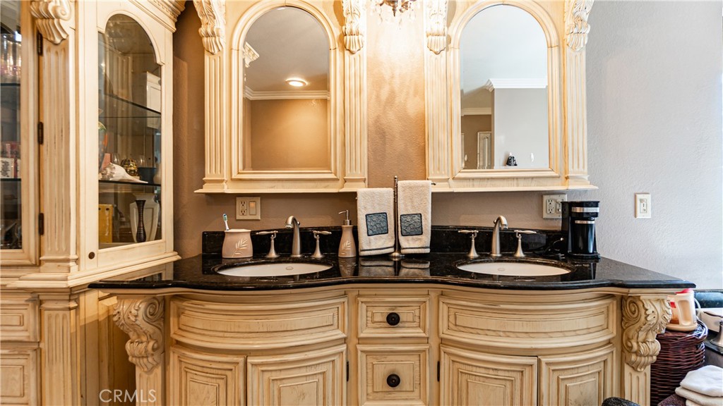 24220 Mentry Drive Newhall, CA 91321 - Photo 29 of 50 a kitchen with stainless steel appliances granite countertop a sink and cabinets with wooden floor