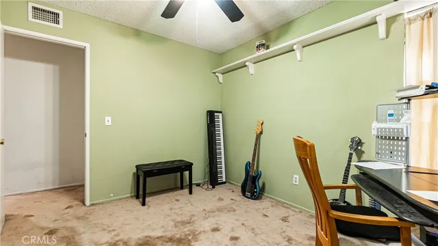 a view of a balcony with furniture