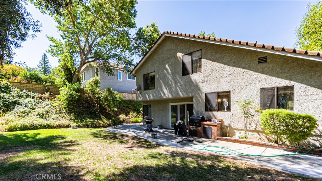 24220 Mentry Drive Newhall, CA 91321 - Photo 38 of 50 a view of a house with backyard and sitting area