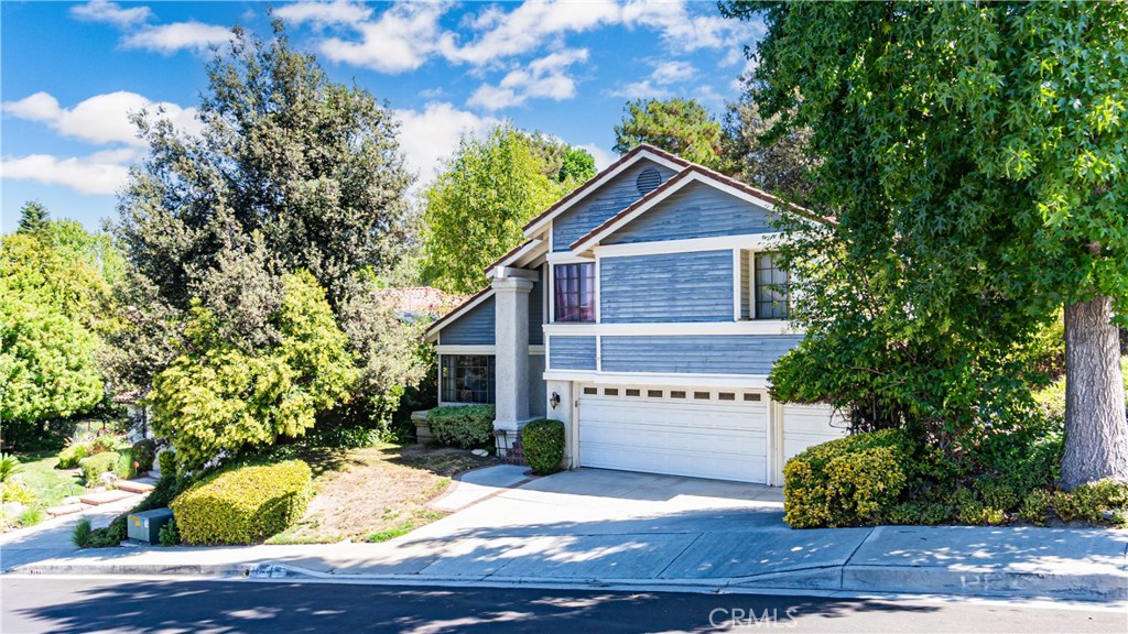24220 Mentry Drive Newhall, CA 91321 - Photo 40 of 50 a view of house with yard and sitting area