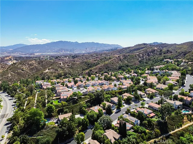 an aerial view of residential house and sandy dunes