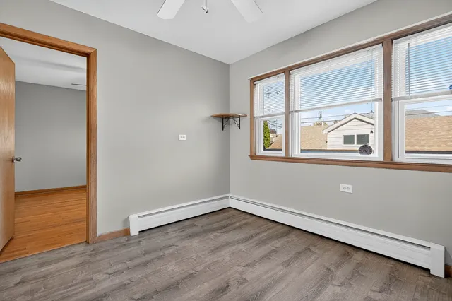 a bedroom with bed and a window