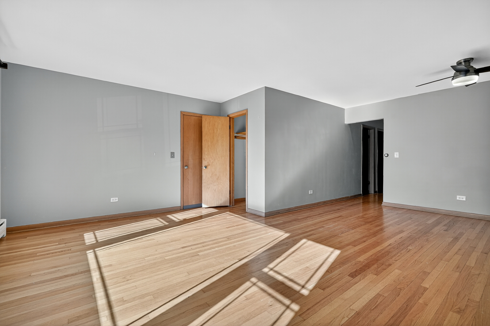 6408 West Raven Street, Unit 1 Chicago, IL 60631 - Photo 7 of 24 a view of an empty room with wooden floor