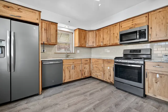 a view of a kitchen sink and a window