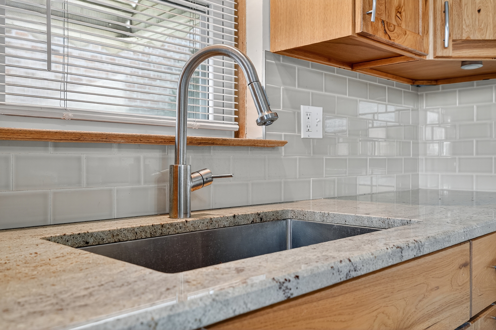 6408 West Raven Street, Unit 1 Chicago, IL 60631 - Photo 9 of 24 a view of a kitchen sink and a window